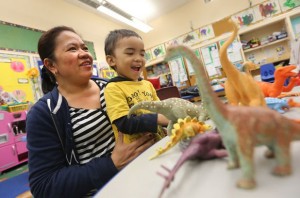 Venus Mawirat picks up her 3-year-old son Galen at APS daycare at North Preparatory Public School in Toronto.